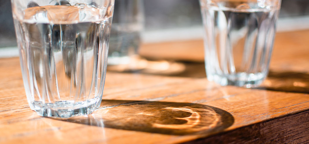 An image of a crystal-clear glass of water, symbolizing purity, hydration, and the simple yet essential role that water plays in maintaining overall health and wellness.
