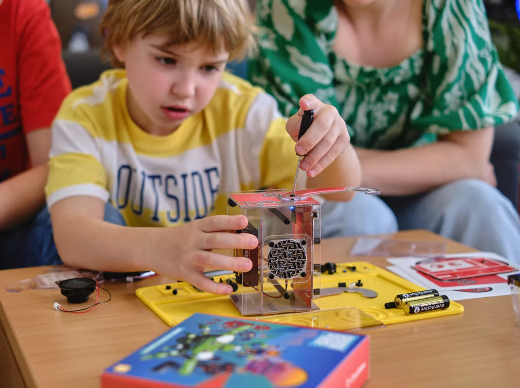 8-year-old assembling Wacky Robots subscription box
