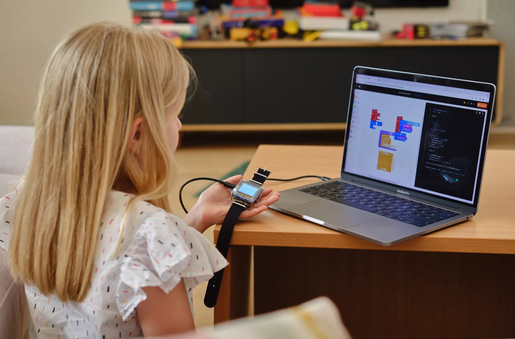 Girl coding her Clockstar DIY smartwatch