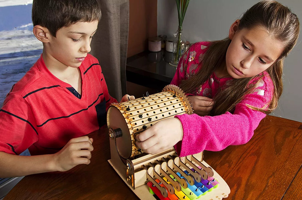 Kids playing with their DIY music machine