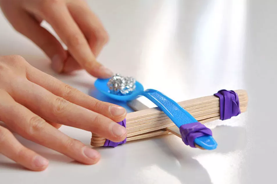 DIY popsicle catapult is one of the most fun STEM challenges for kids at home