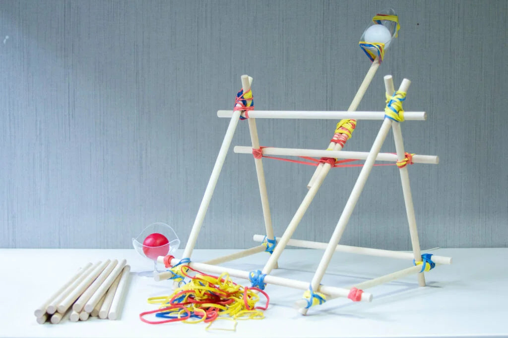 Engineering activity for kids - building a DIY catapult