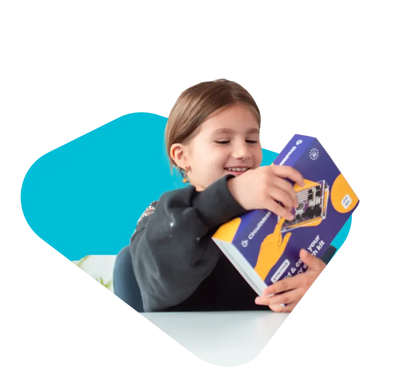 Kid holding Synthia box