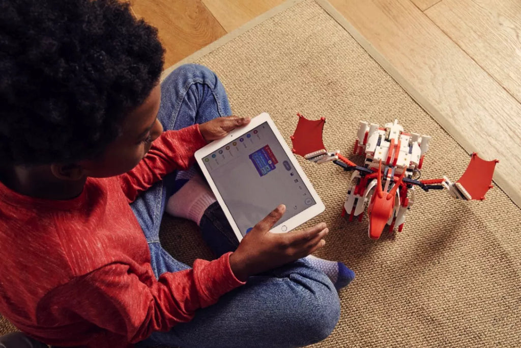 Playing with Jimu Firebot educational toy for boys