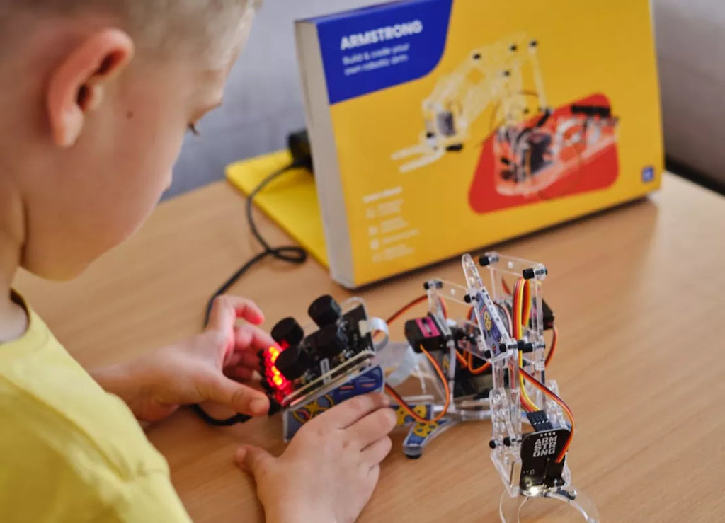 Kid learning engineering by building a mechanical device