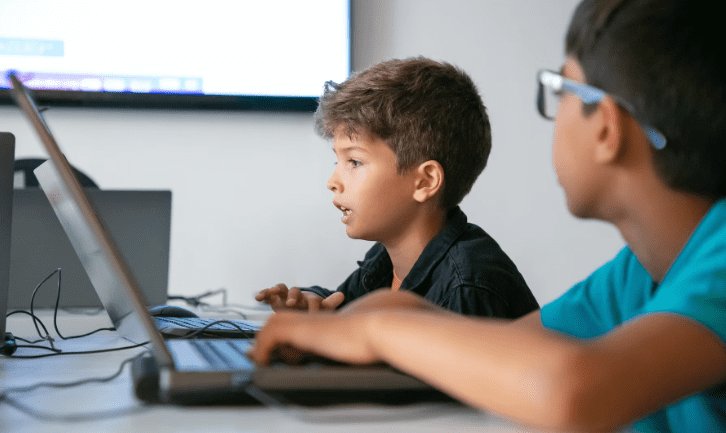Middle schoolers learning how to master coding and computer programming