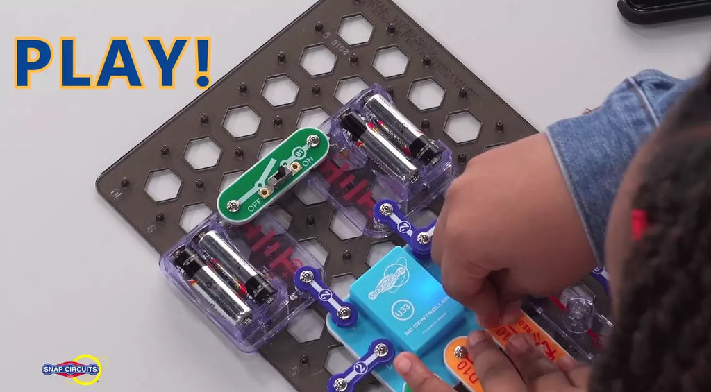 Kid playing with Snap Circuit Beginner science kit for kids