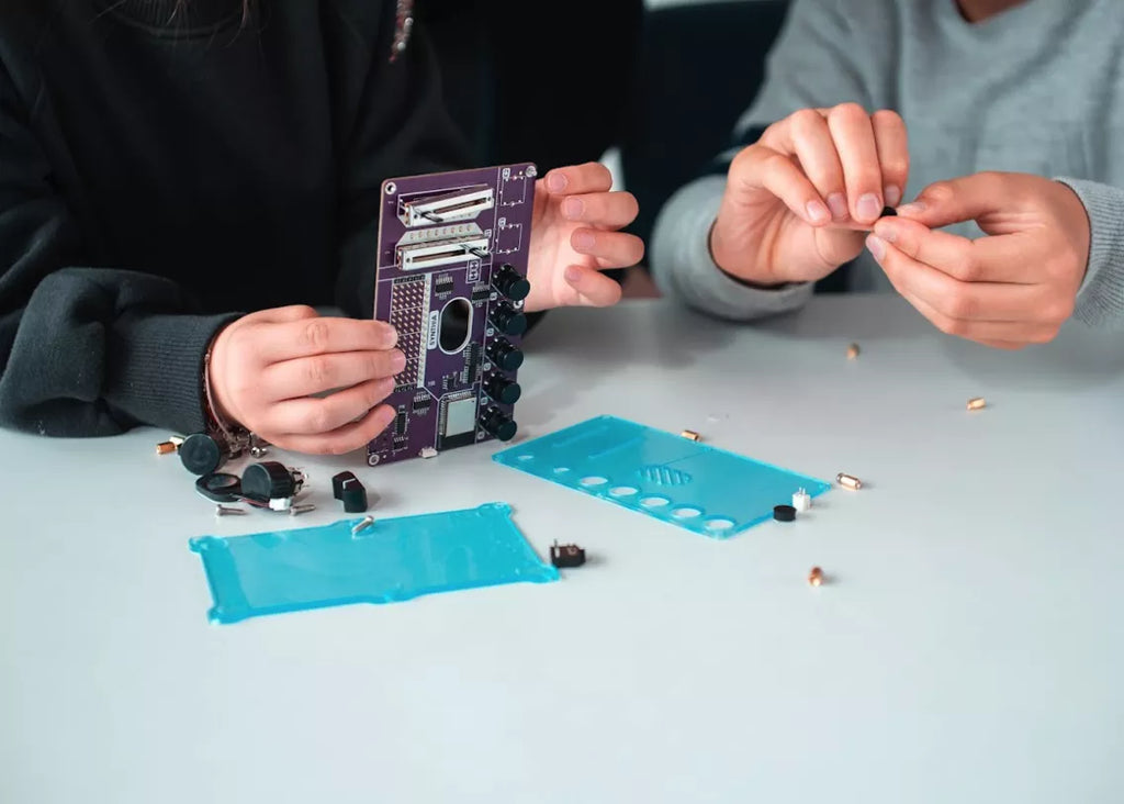 Kids assembling their DIY music machine