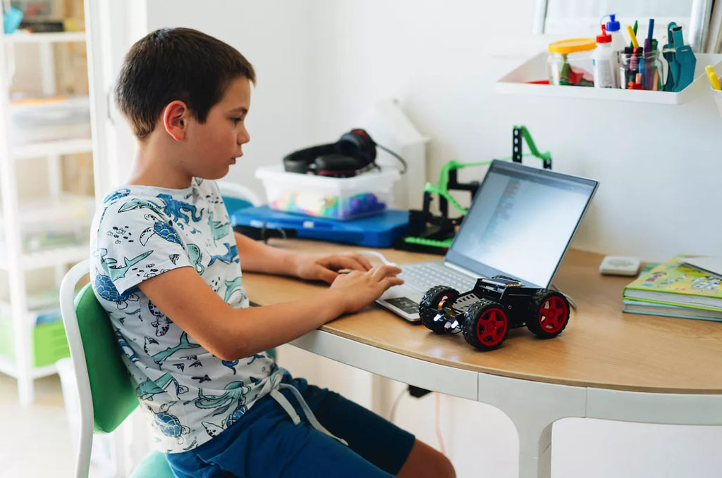 Kid playing with Wheelson - educational DIY AI robot car