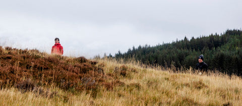 two walkers in the scottish countryside