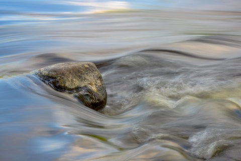 Flowing river over a rock