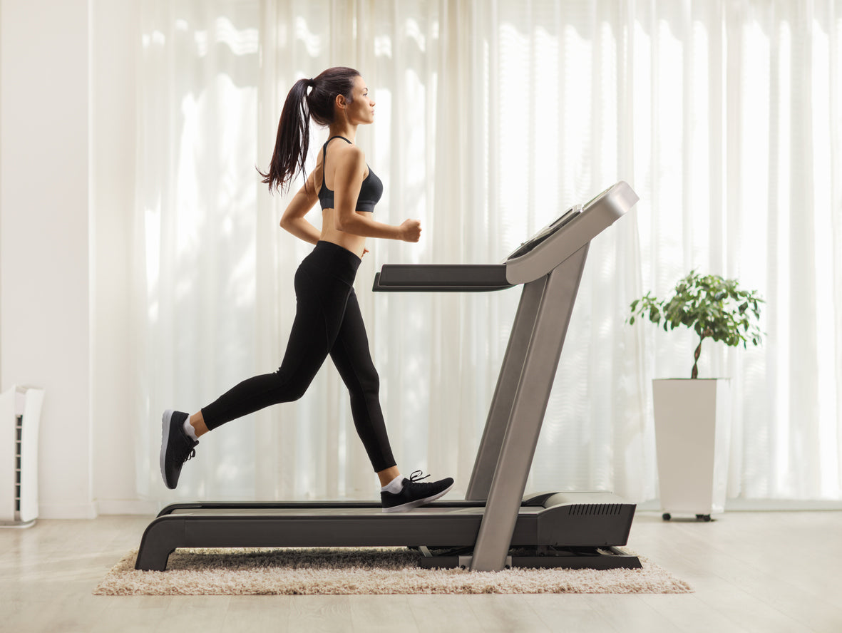 Woman Running on Home Treadmill