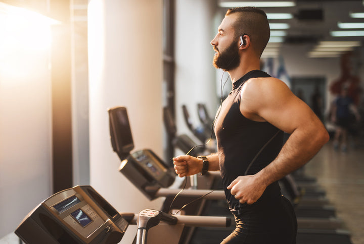 Man Running to Music on Treadmill