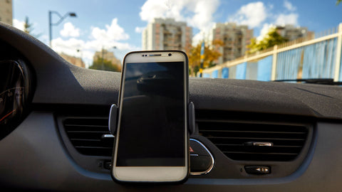 A phone air vent mount inside a vehicle