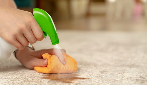 cleaner trying to remove oil stains from bamboo bedsheets