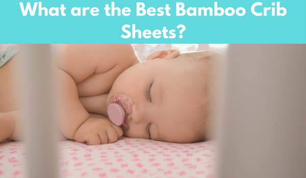 a baby sleeping over the best bamboo crib sheets