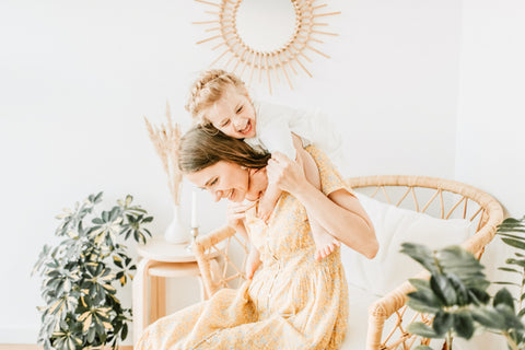 A daughter hugging her mom