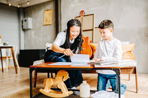 Mom doing homework with son