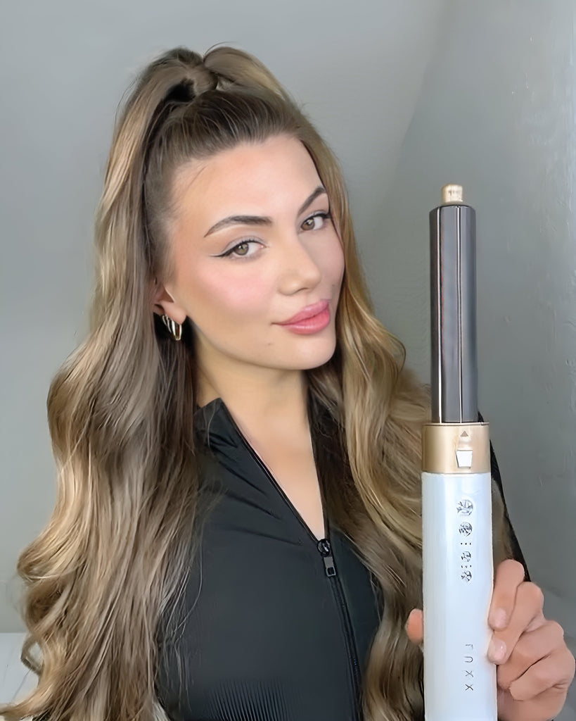 Versatile hot air styler for curls, waves, and straightening.