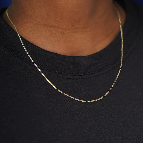 Automic Gold necklace around neck