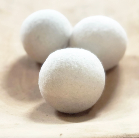 3 white laundry balls made by Commongoods