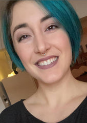 Woman with short blue hair pixie