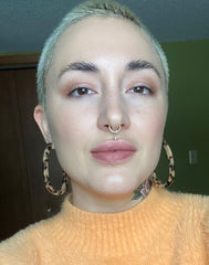 woman with blonde buzz cut