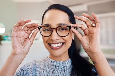 Woman trying on glasses