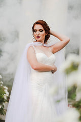 White Smoke Bomb behind woman wearing white wedding dress