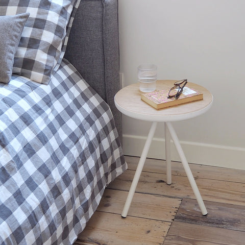 Round coffee table as a bedside table