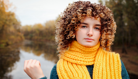 Curly hair teen in yellow scarf