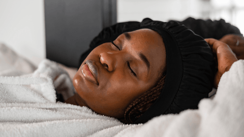 girl with curly hair sleeping