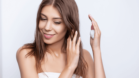 photo of a girl putting curl cream