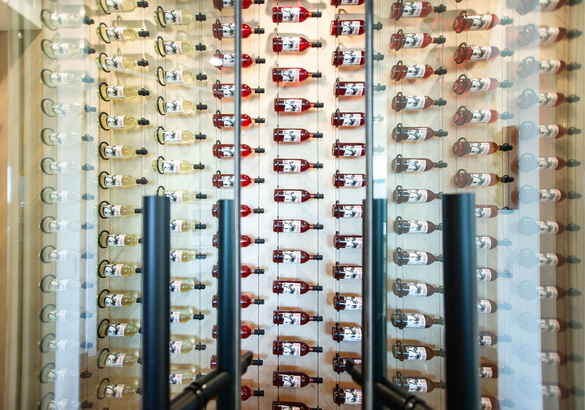 modern glass wine wall with floating wine racks by Genuwine Cellars Reserve