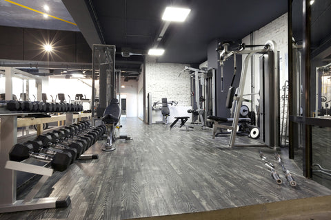 a picture of an empty gym with various gym machines