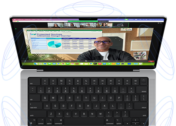 MacBook Pro surrounded by illustrations of blue circles to suggest the 3D feeling of Spatial Audio — Onscreen, a person uses the Presenter Overlay feature in a Zoom video meeting to appear in front of the content they are presenting