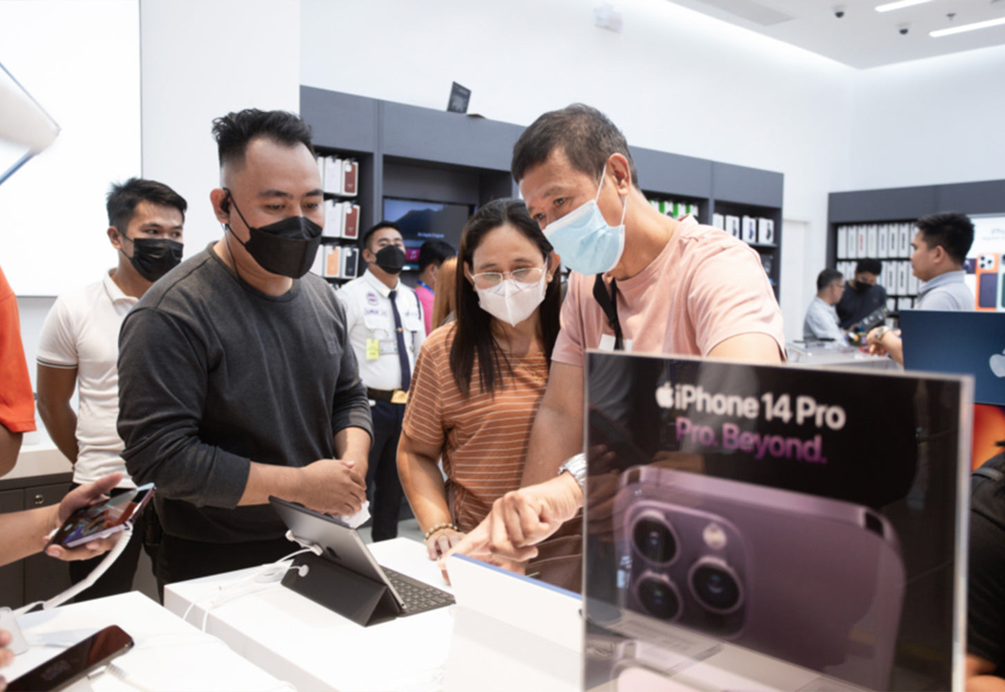 People checking out devices and accessories at PMC SM City Roxas Opening