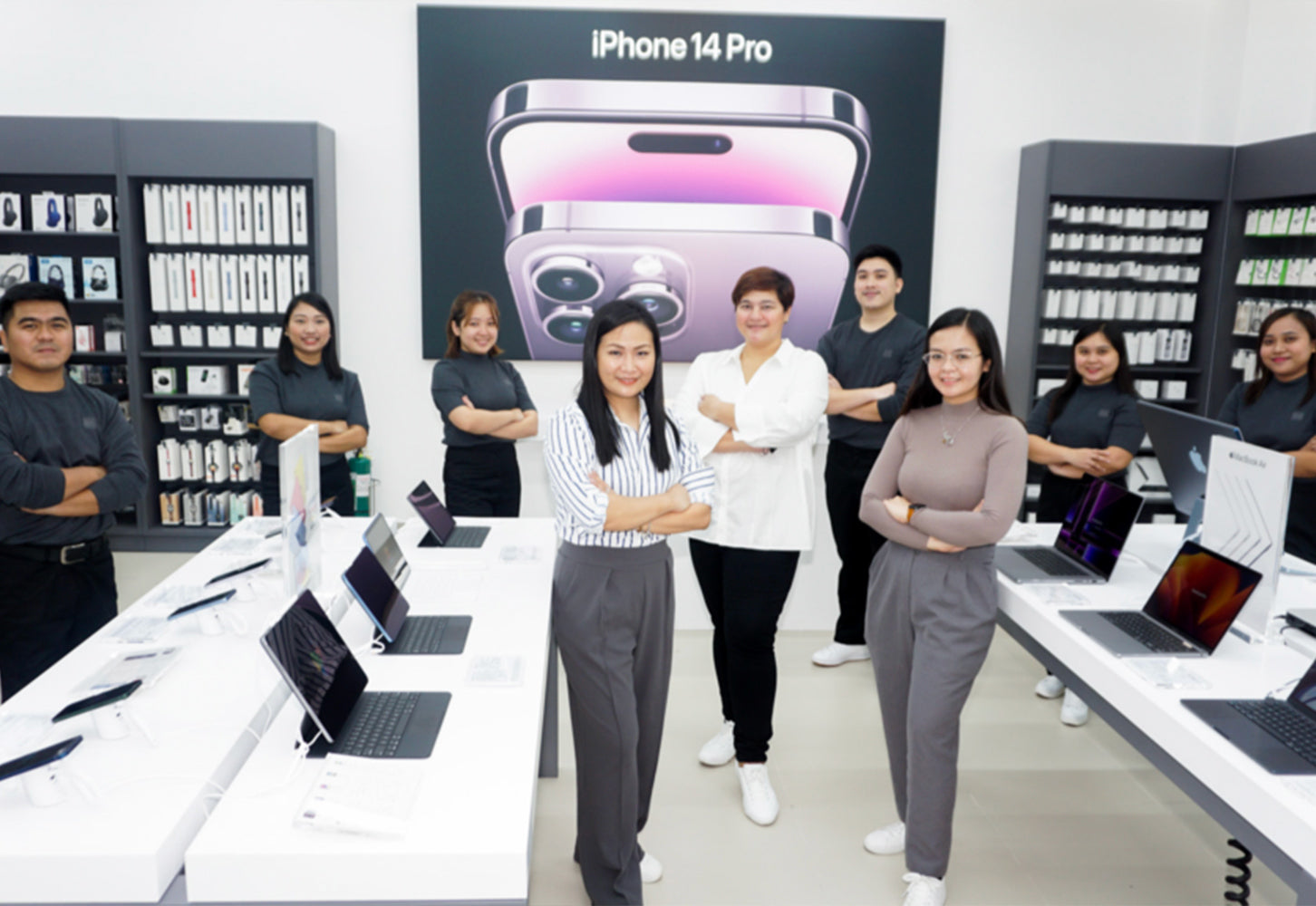 Store Sales Team line up for a photo inside Power Mac Center Ilocos Norte store