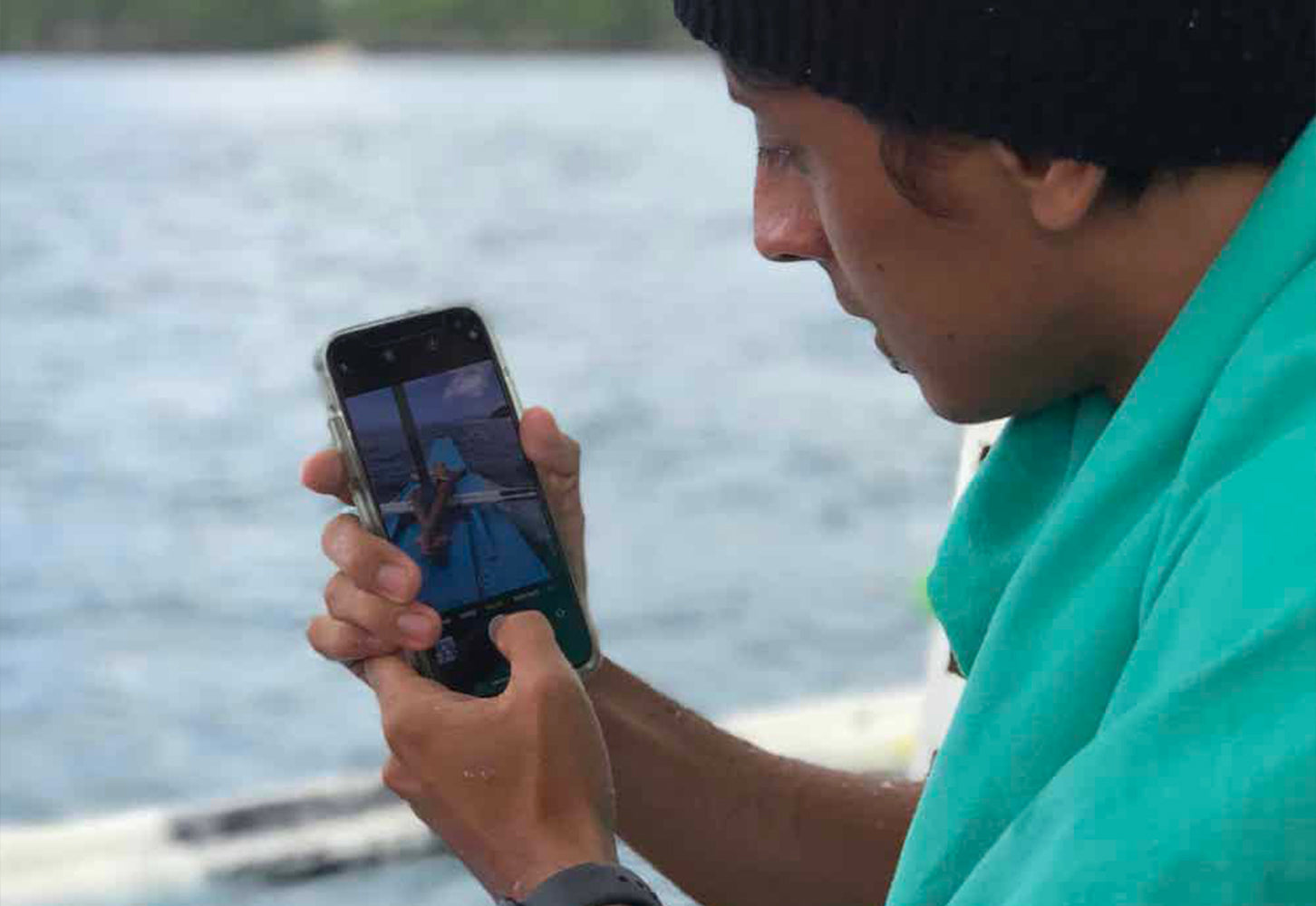 Man using iPhone on a travel
