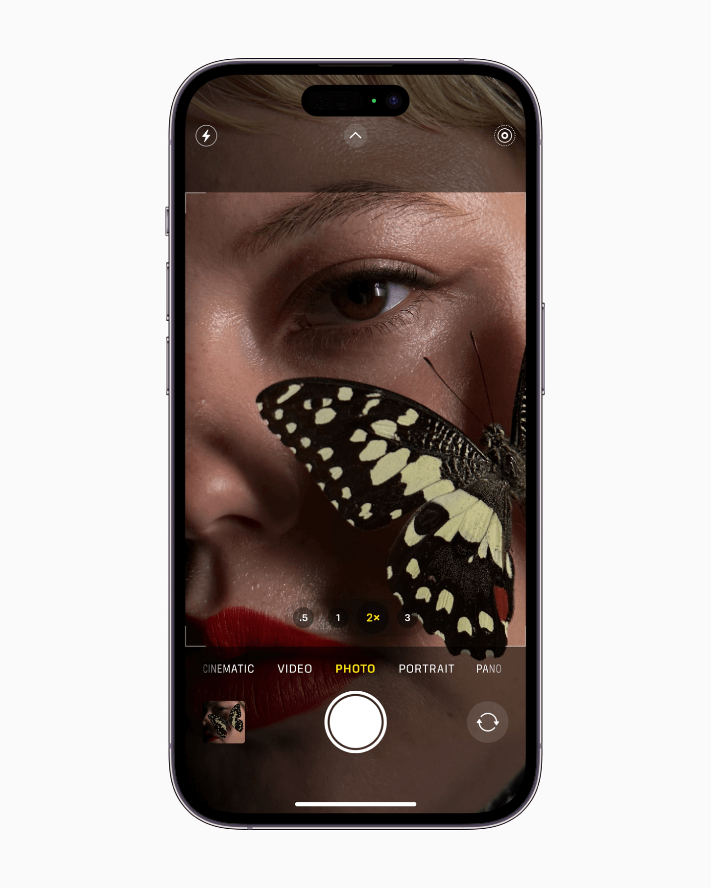 iPhone 14 shot of a girl with a butterfly on cheek