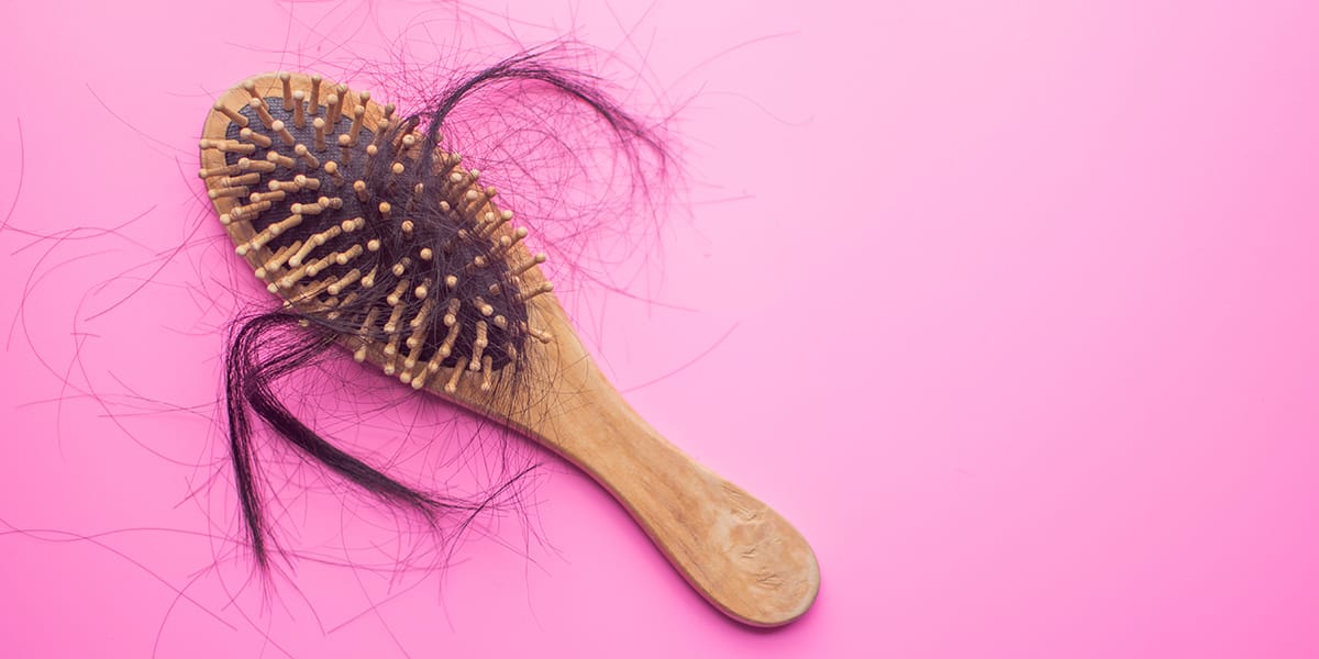 A brush with hair that's fallen out