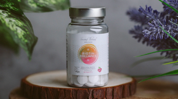 Close up image of the Biotin Brilliance supplement in jar
