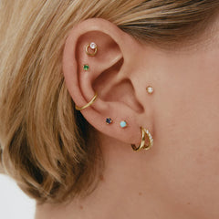 oreja pendientes y piercings