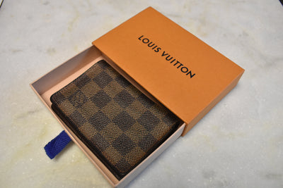 Lv Damier Wallet On Chain Link Fence