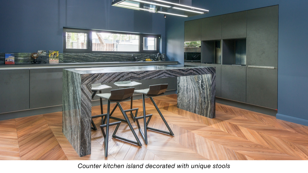 Counter kitchen island decorated with unique stools