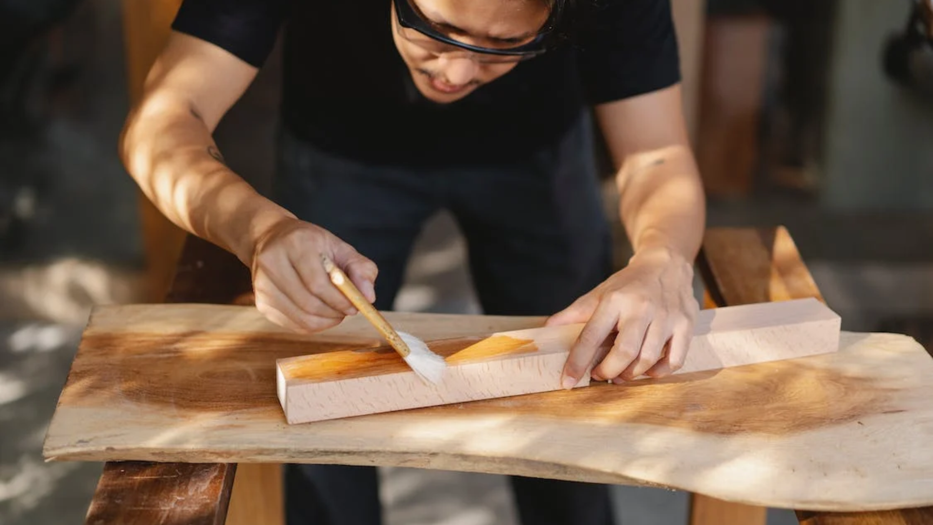 To protect your DIY round table base from wear and tear, apply a clear wood finish like polyurethane or varnish.