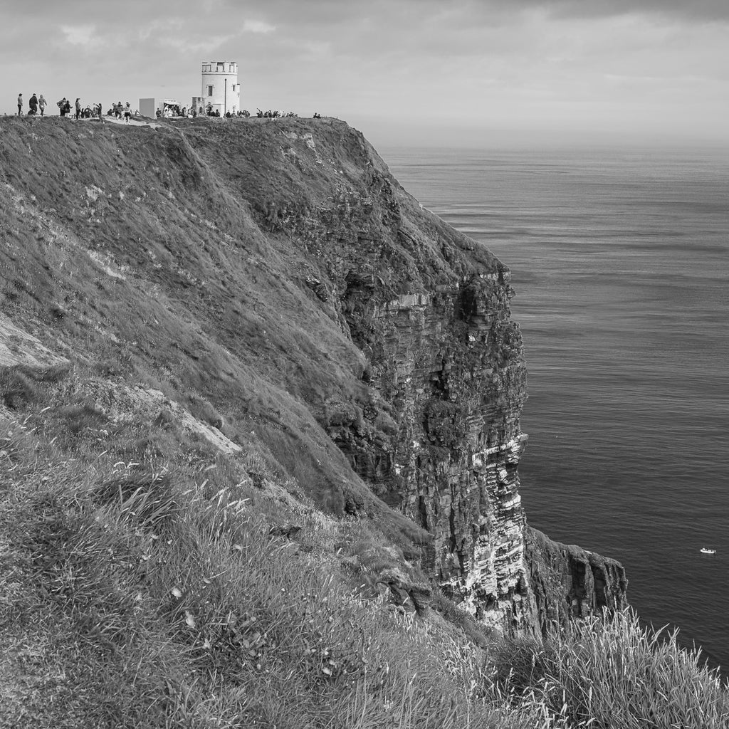 ic:Eternal Elegance: Capturing the timeless grace of the Cliffs of Moher, where the stark contrasts of nature's artistry are displayed in every crag and curve.