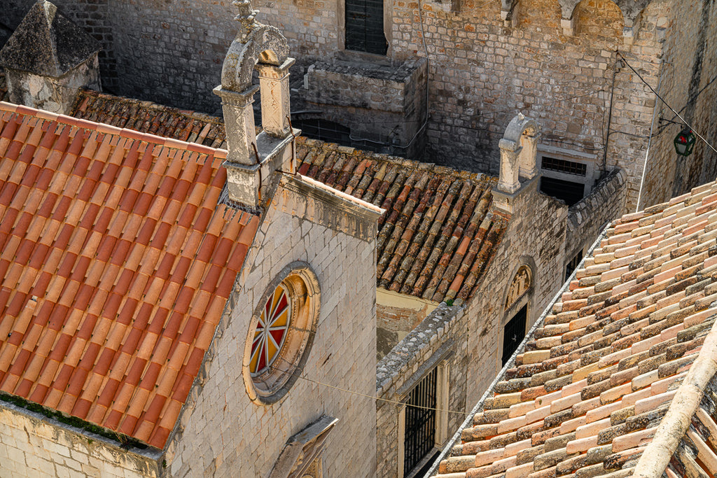 ic:Stunning rooftop view overlooking a church in Dubrovnik, highlighted by the picturesque Croatia roof tiles.