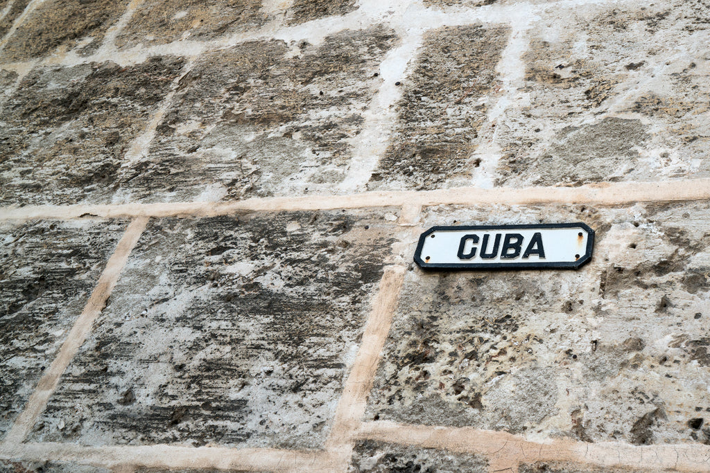 ic: Cuba street sign outside of the church wall