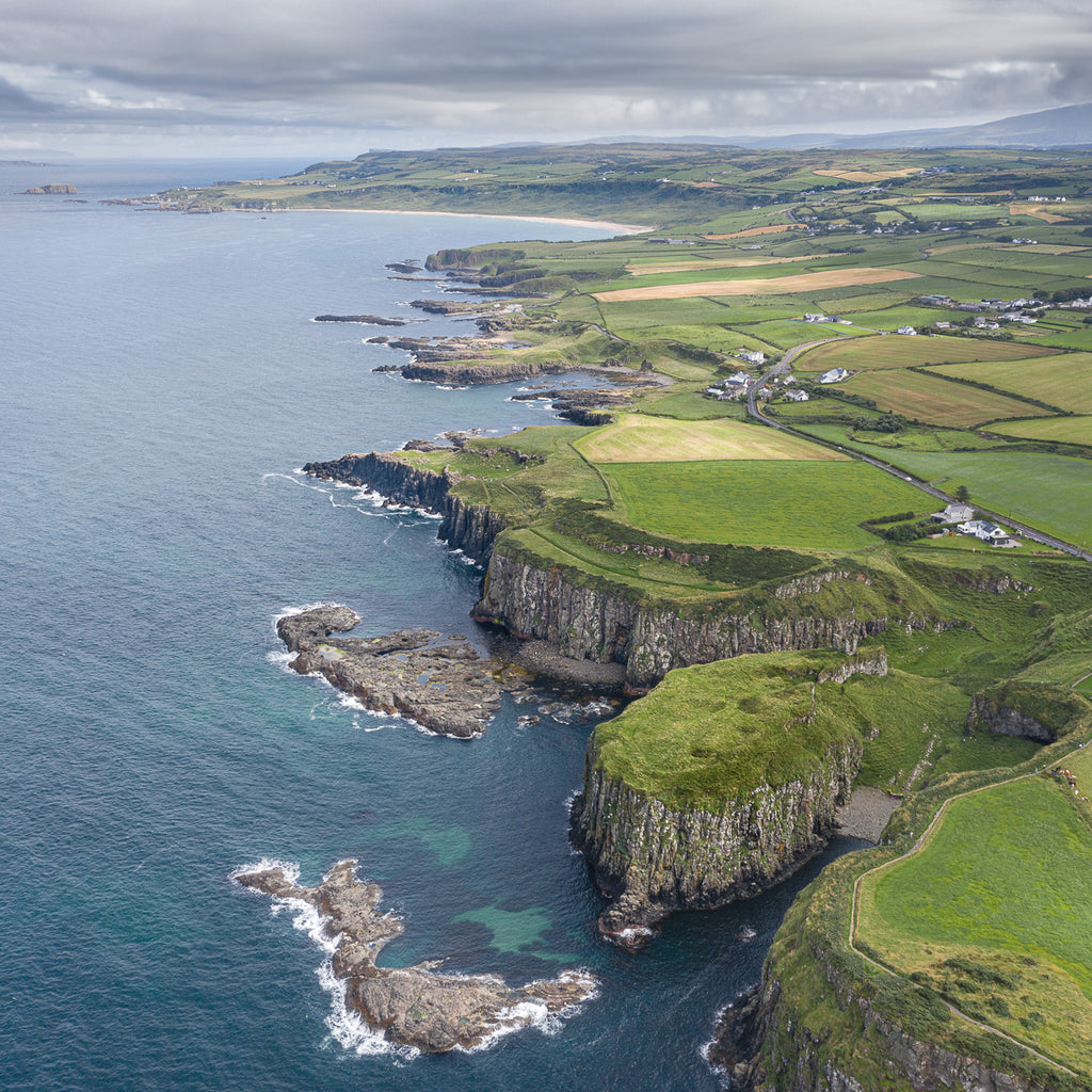 ic:Majestic Geology: An aerial view of Giant's Causeway, where Northern Ireland's natural wonder tells tales of ancient volcanic legacies.